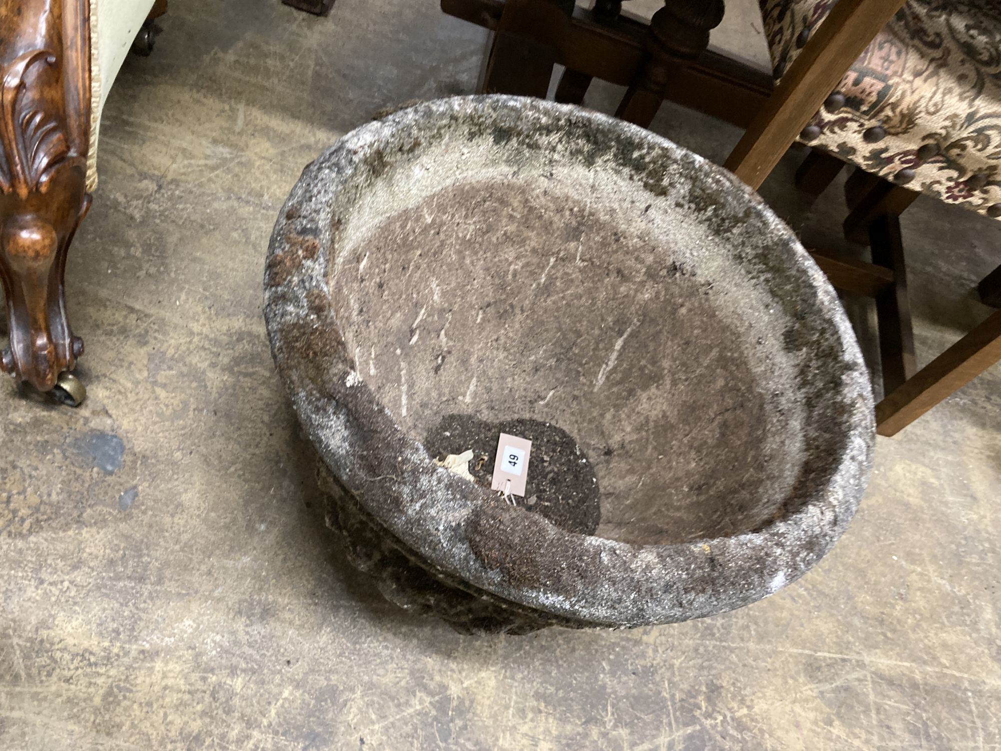 A reconstituted stone garden urn, 49cm diameter, height 34cm